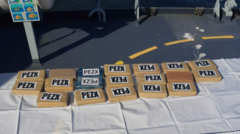 Four charged after suspected cocaine found on boat