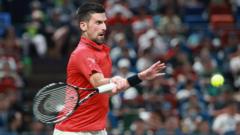 Djokovic battles through injury to reach last eight