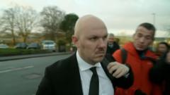 Moment man shoves TV reporter before being jailed for selling suicide drugs