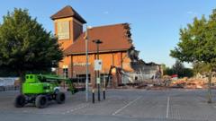 Boys, 13, arrested after fire destroys part of shopping centre