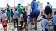 Warri Bank staff jump fence