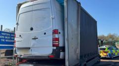 Police spot van poking out of lorry on M1