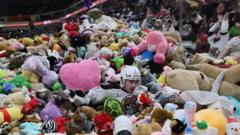 Moment over 100,000 teddy bears fly onto ice rink