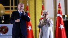 Turkish President Tayyip Erdogan addresses his supporters, next to his wife Ermine Erdogan, following his victory in the second round of the presidential election at the Presidential Palace in Ankara, Turkey May 29, 2023