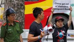 Protester in front of Chinese Embassy in Hanoi