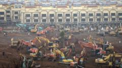 A view of cranes and diggers building Huoshenshan Hospital