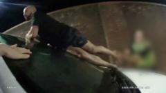 Barefoot man in handcuffs escapes police and scales wall