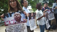 Victims' relatives and their supporters protest against the suspension of the search