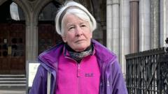 Ex-social worker in High Court over holding placard
