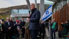 Swinney heckled at vigil for victims of Hamas attacks