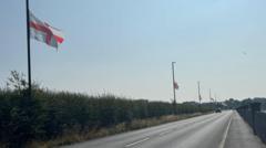 England flags hung by locals taken down