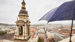 An umbrella is seen next to the bells of St Stephen's Basilica in Budapest