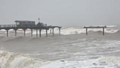 Pier washes away and railway sea wall crumbles in storm