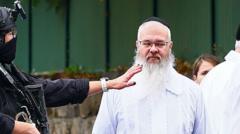 I saw evil as attacker tried to barge into synagogue, rabbi tells BBC