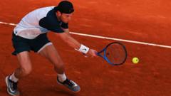 Draper advances in Madrid as matches resume