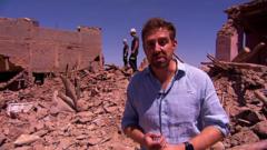 Nick Beake amid rubble in Morocco