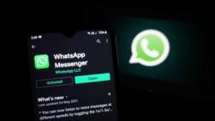 The logo of the messenger app WhatsApp is seen on the screen of a smartphone in New Delhi, India on May 27, 2021.