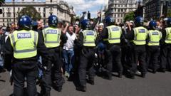 Police form a barrier in front of protesters in Parliament square