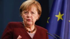 Angela Merkel at a lectern