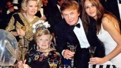 Mary Trump in 1999, shortly before she died, with daughter Elizabeth, son Donald and his then-girlfriend Melania Knauss
