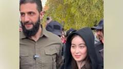 Syria rebel leader dismisses controversy over photo with woman