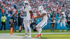 Miami wide receiver Hill calls for police officer to be fired