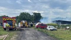 Crews tackle outbuilding fire in village