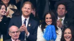 Harry and Meghan cheer from stands at Invictus Games in Canada