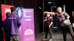 Top darts stars visit college to help maths skills