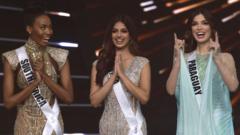 The final three Miss Universe contestants pose on stage during the 70th Miss Universe beauty pageant in Israel's southern Red Sea coastal city of Eilat.