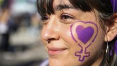 A woman with a purple heart and woman symbol painted on her face