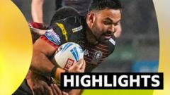 Leaders Wigan strike late to stun Salford