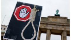 An anti-hanging placard is seen during a protest against the Iranian regime following the death of Mahsa Amini
