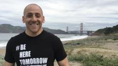 Kevin Hines posing with the Golden Gate Bridge in the background