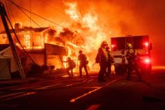 In pictures: Dramatic scenes as wildfires sweep through west LA