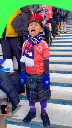 Young Scotland fan's singing goes viral online