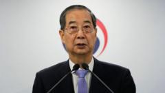 South Korea court reinstates PM as acting leader