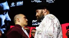 Fury and Usyk stare at each other for 11 minutes in astonishing face-off