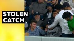 Thief! Cheeky fan attempts to steal caught home run