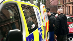 Man, 29, charged after police raid over racist traffic-cone attack