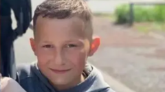 Fourteen children arrested over boy's death in fire