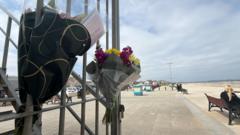 Dad who died helping two children in sea named