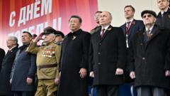 Putin hosts Victory Day parade with tight security and a short ceasefire