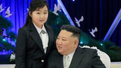 North Korean leader Kim Jong Un talks with his daughter Kim Ju Ae at a banquet to celebrate the 75th anniversary of the Korean People's Army in Pyongyang, 7 February 2023