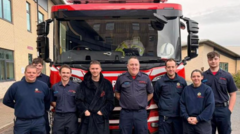 Firefighters' hill climb for colleague with cancer