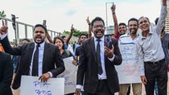 Lawyers and civil rights activists take part in a protest against the Prevention of Terrorism Act (PTA) law, which allows for the prolonged detention of suspects without trial, near the Presidential Secretariat in Colombo on October 10, 2022.