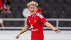 Manchester Utd midfielder Devaney joins Hibs on loan