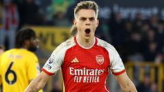 Arsenal win at Wolves to return to top spot