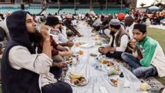 muslims breaking ramadan fast with ceremonial meal iftar