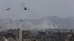 Aftermath of what appears to have been a strike in Tehran, with smoke going up in the air from buildings
